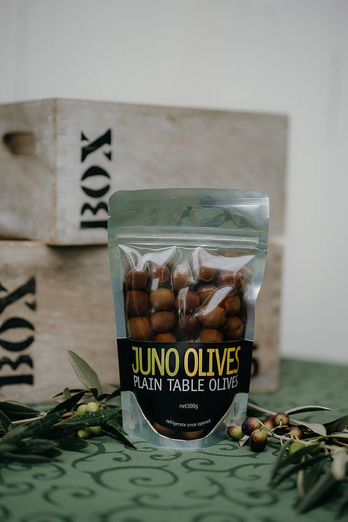 300 gm packet of table olives with olive leaf and olives.